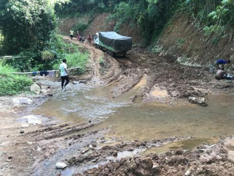 Contractor's trucks driving to Lailenpi